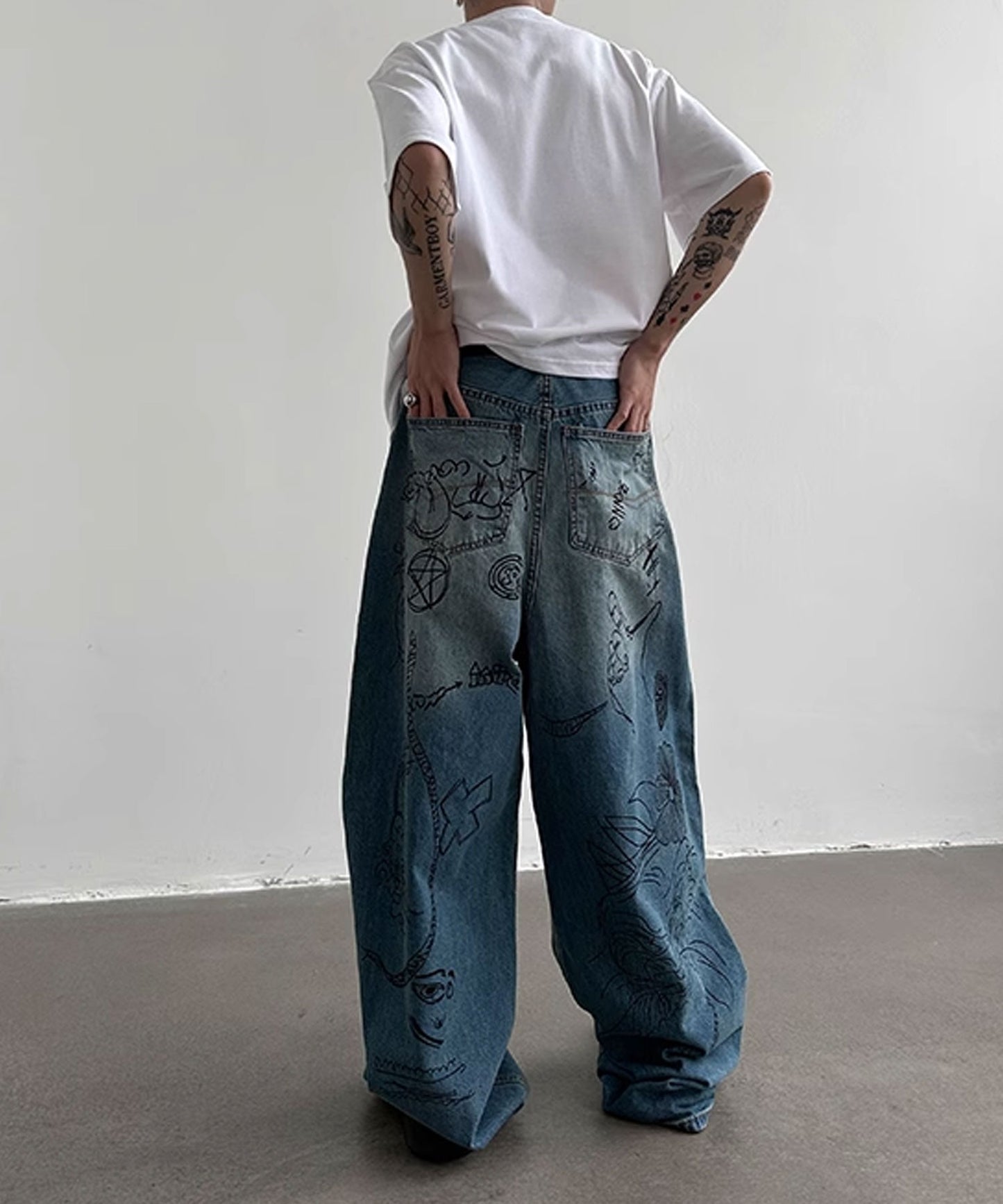 Theater code / illustration print wide denim pants