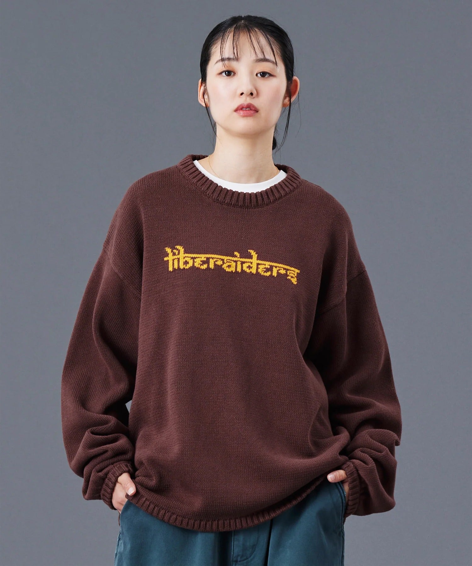 Liberaiders / WOVEN LOGO KNIT SWEATER