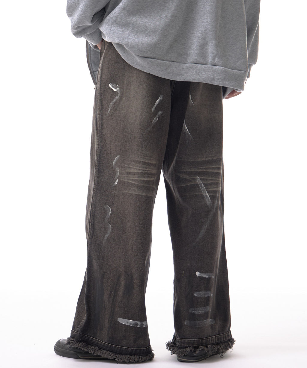 Theater code / irregular switching graffiti denim pants