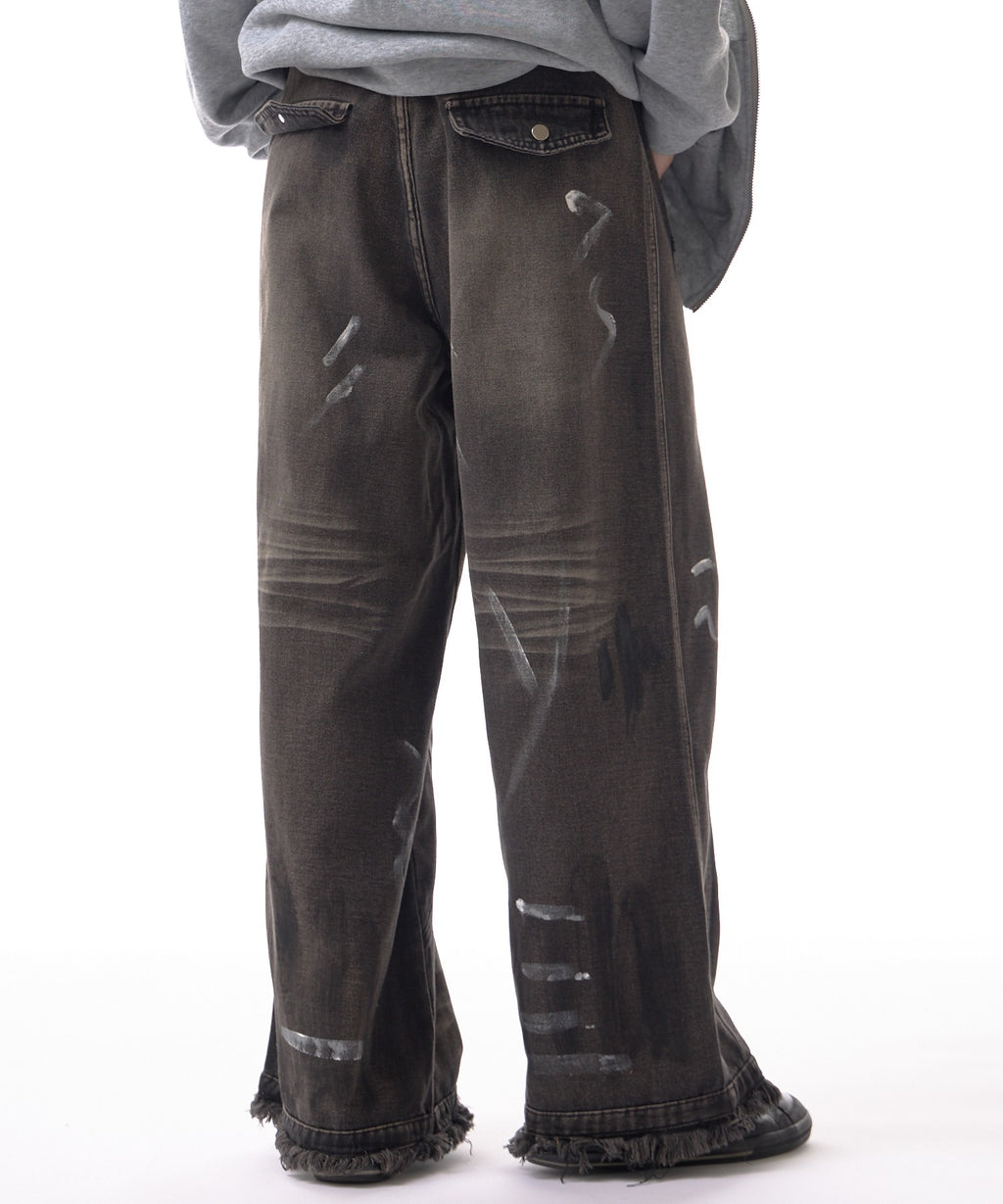 Theater code / irregular switching graffiti denim pants