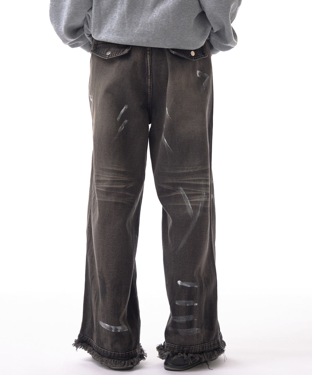 Theater code / irregular switching graffiti denim pants