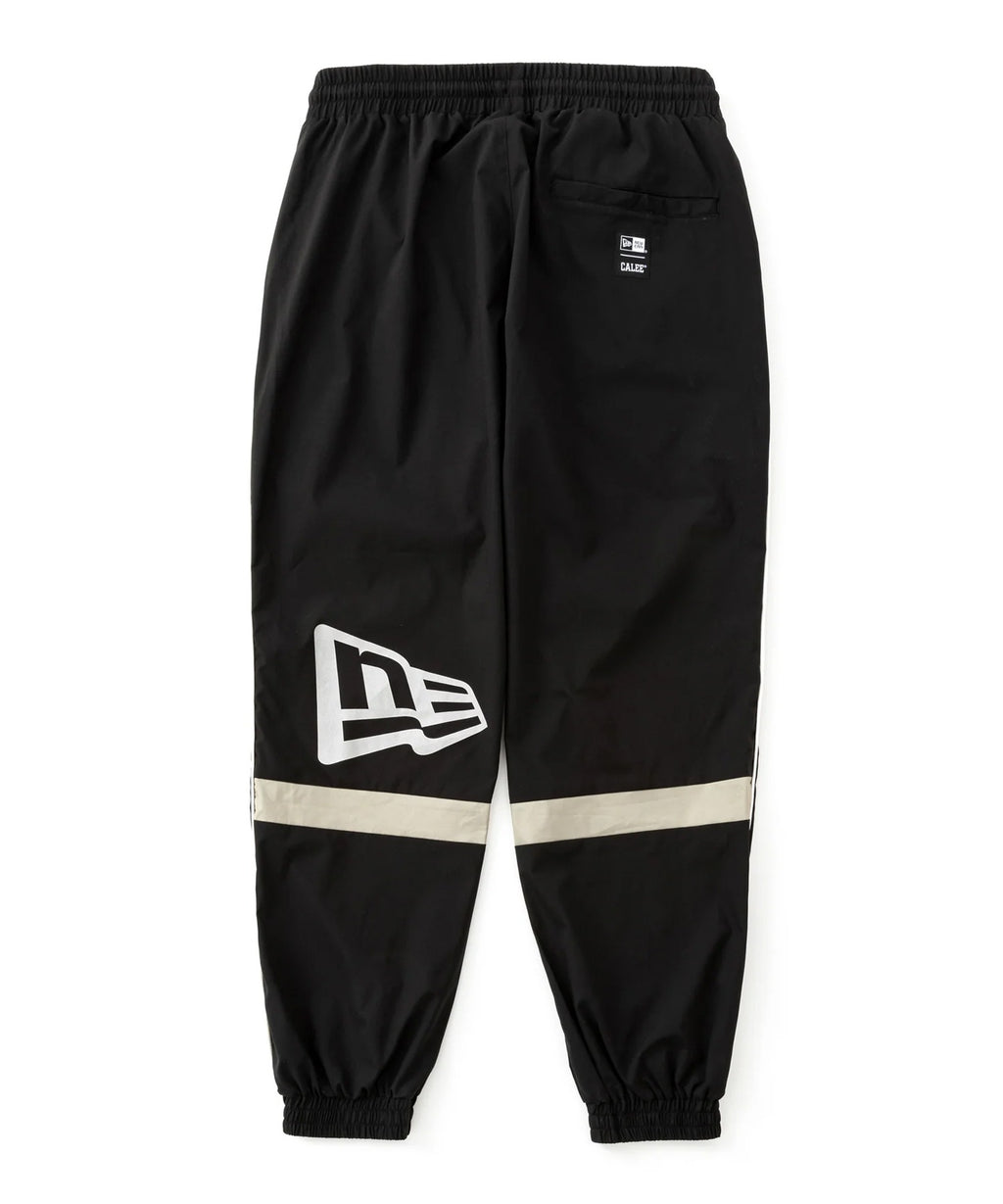 CALEE × NEW ERA/ CALEE LOGO OVERSIZED PIPING TRACK PANTS